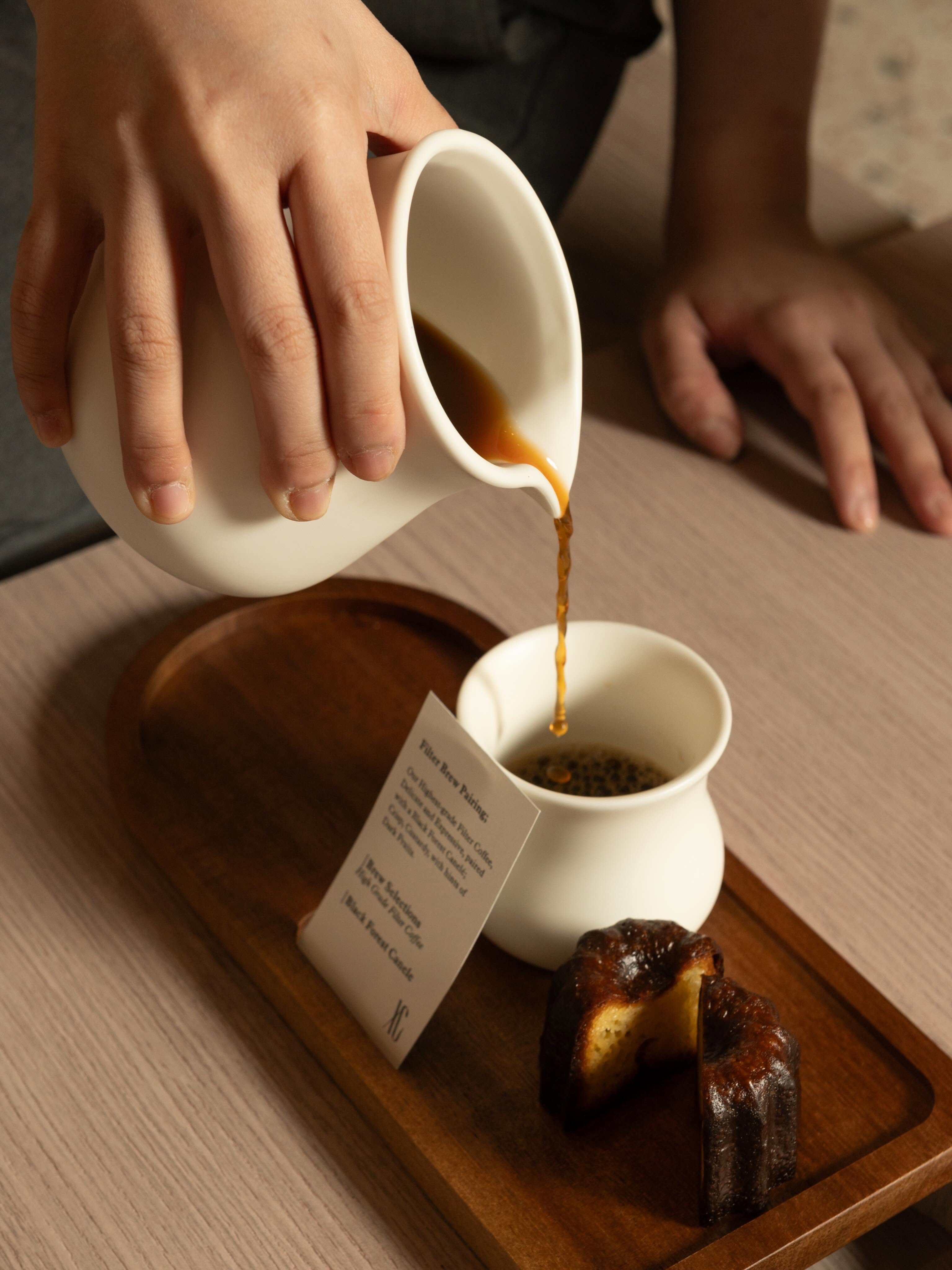 Filter coffee poured into a canele-shaped cup at Xoco